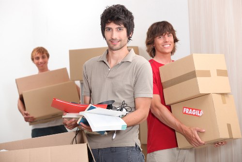 Moving team preparing flat removals in Waterloo near an apartment building