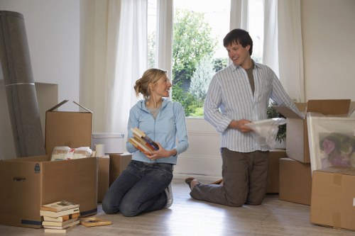 Professional movers transporting furniture during a Waterloo house move