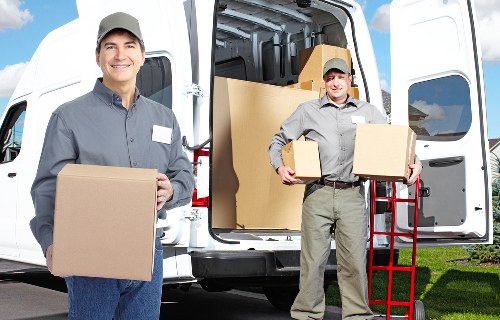 Careful loading of household items into a van