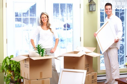 Professional moving team with van during delivery