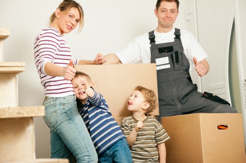 Waterloo movers carefully wrapping household items for safe transport